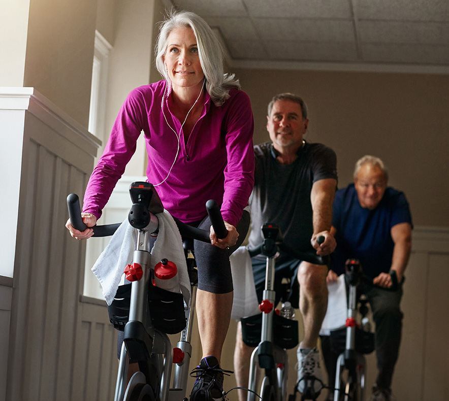 people on exercise bikes