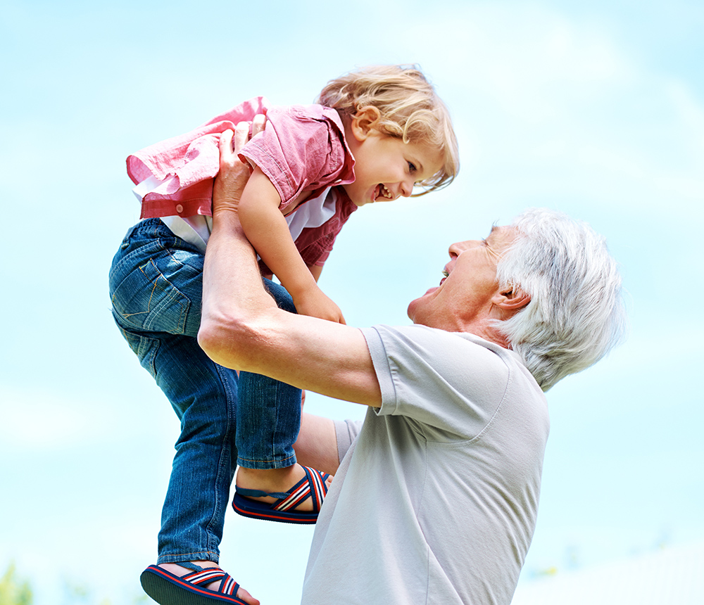 grandfather lifting child