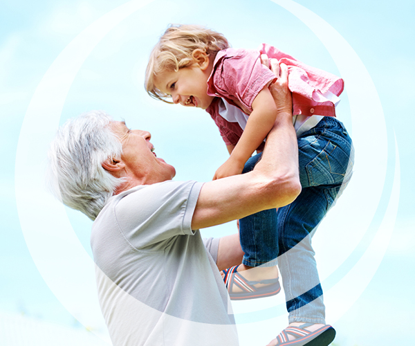 Grandpa lifting child