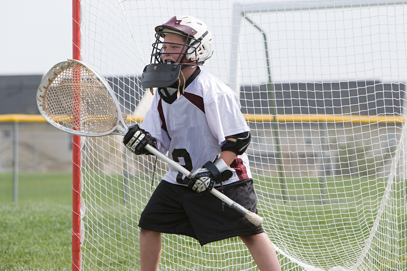 kid playing lacrosse