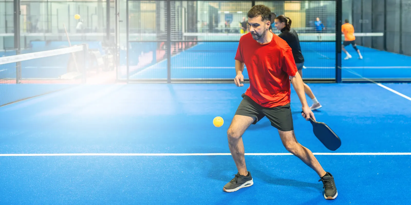 man playing pickleball