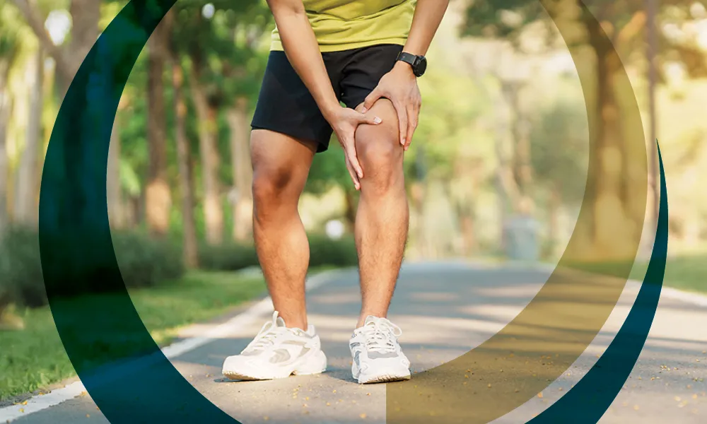 runner holding knee