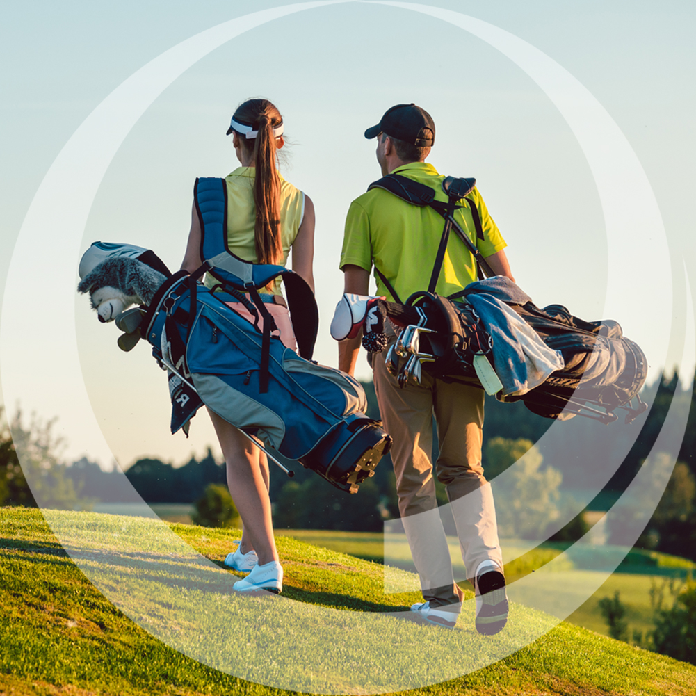 golfing couple walking