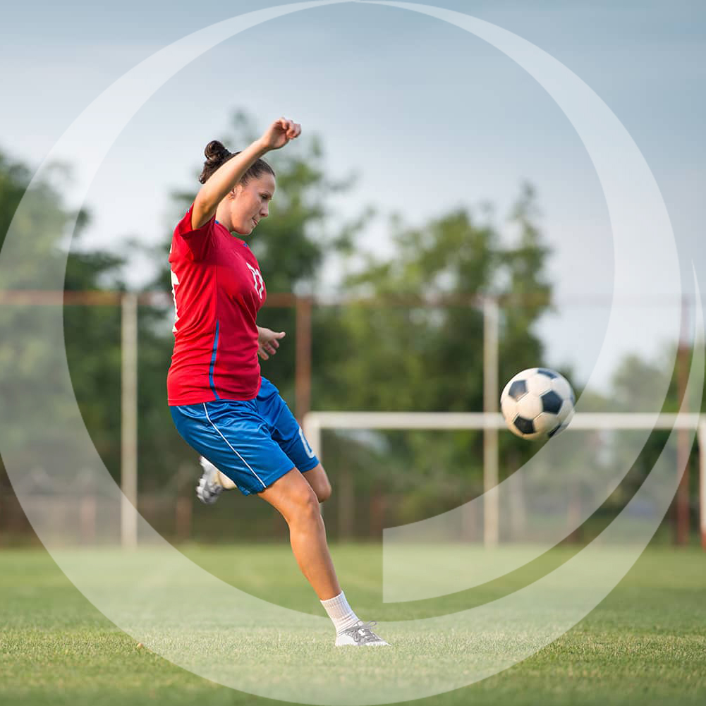 girl playing soccer